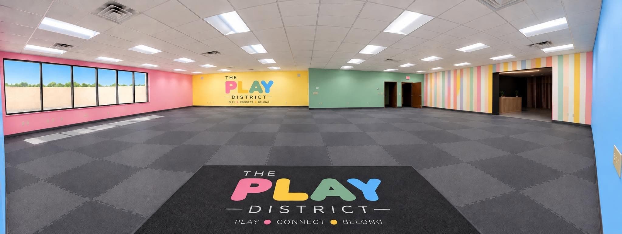 The Play District's colorful, open indoor space before play areas are installed